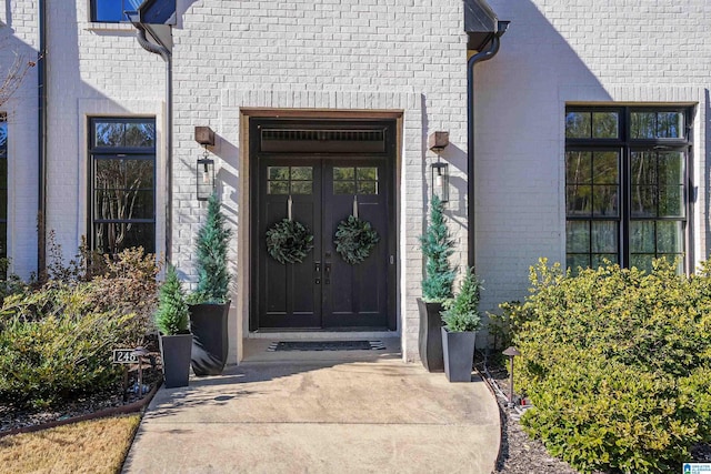 view of exterior entry featuring french doors