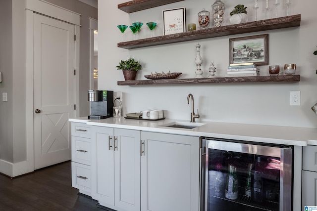 bar with sink, dark hardwood / wood-style flooring, white cabinetry, and wine cooler