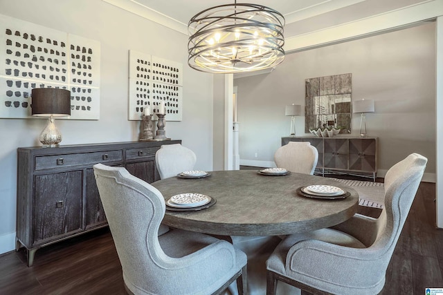 dining room featuring a notable chandelier, dark wood-type flooring, and crown molding