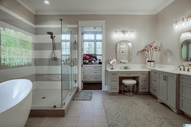 bathroom featuring separate shower and tub, tile patterned flooring, crown molding, and vanity