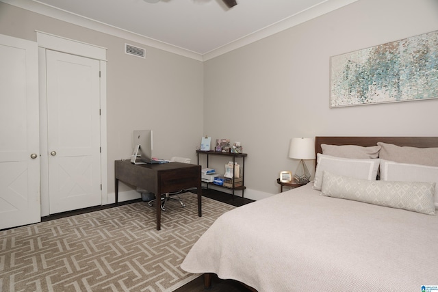 bedroom featuring ceiling fan and ornamental molding