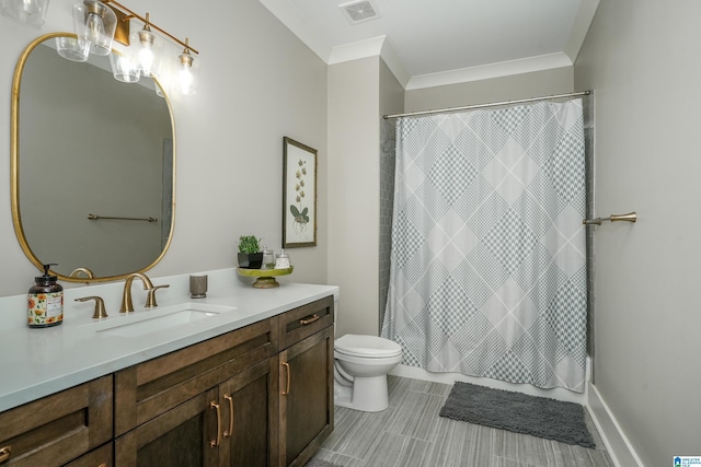 bathroom featuring toilet, ornamental molding, and vanity