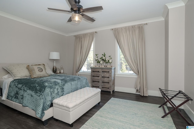 bedroom with ceiling fan, ornamental molding, and dark hardwood / wood-style floors