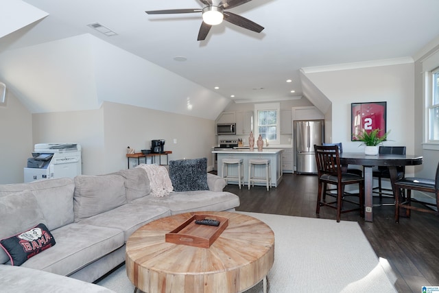 living room featuring vaulted ceiling, ceiling fan, crown molding, and dark hardwood / wood-style flooring