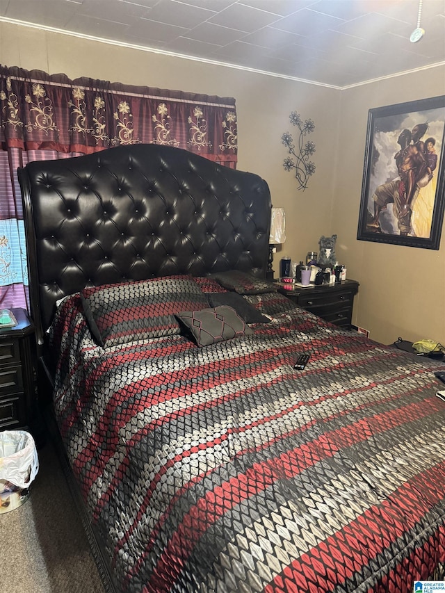 bedroom with carpet and ornamental molding