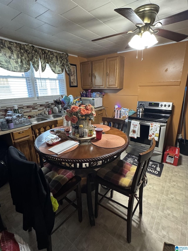 dining space featuring ceiling fan