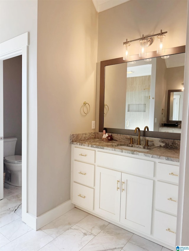 bathroom with toilet and vanity