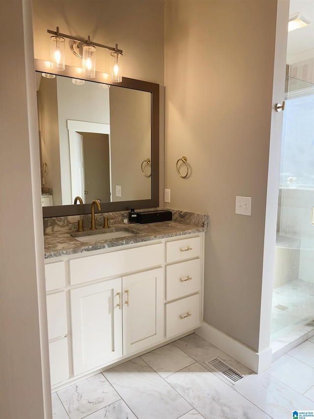 bathroom featuring walk in shower and vanity