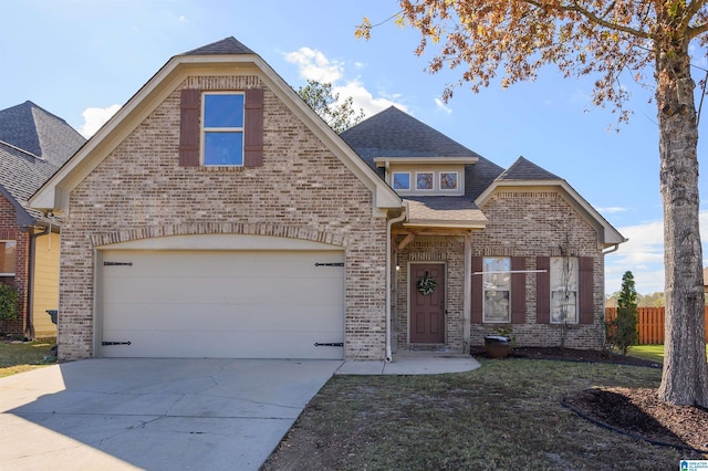 front of property with a front lawn and a garage