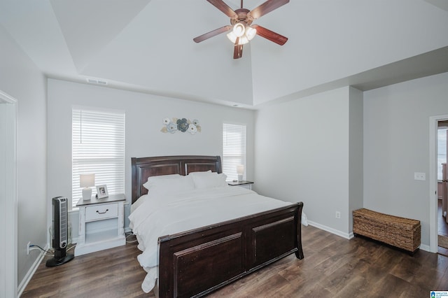 bedroom featuring ceiling fan, dark wood-type flooring, and vaulted ceiling