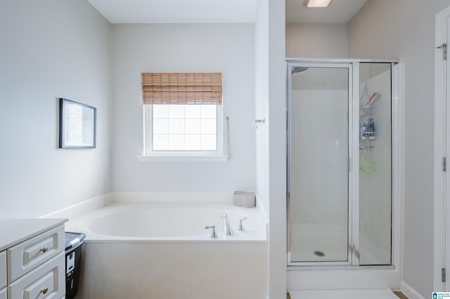 bathroom with plus walk in shower and vanity