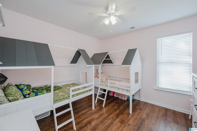 bedroom featuring ceiling fan and dark hardwood / wood-style floors