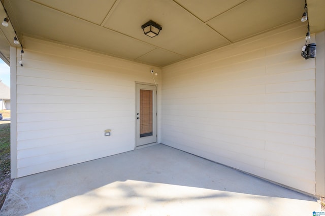 property entrance featuring a patio