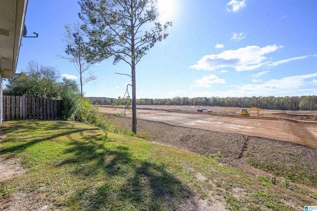 view of yard with a rural view