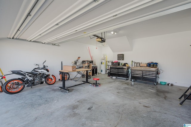 garage with electric water heater and a garage door opener