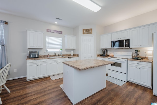 kitchen with a center island, white cabinets, sink, white electric stove, and dark hardwood / wood-style flooring