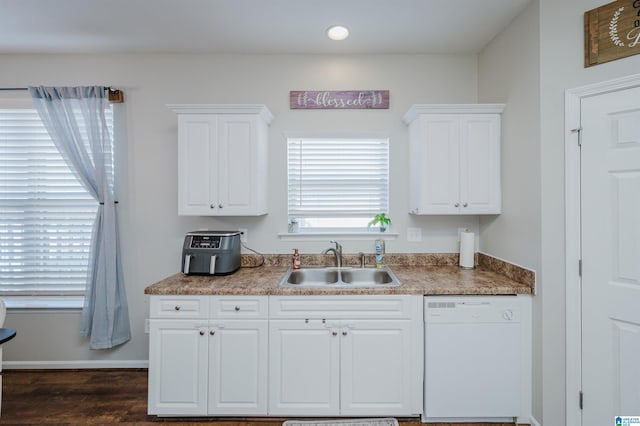 kitchen with white cabinetry, sink, white dishwasher, and plenty of natural light