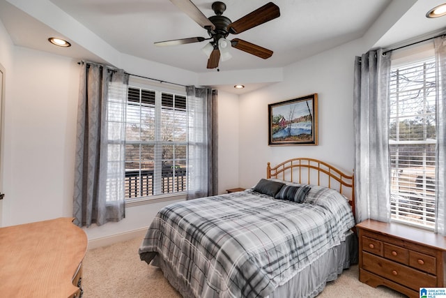 bedroom with light carpet and ceiling fan