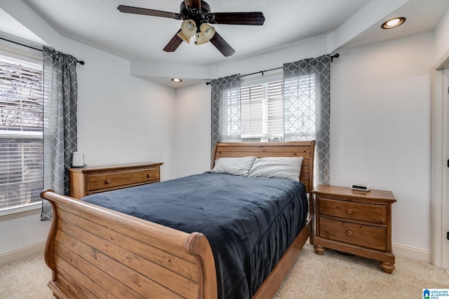 bedroom featuring ceiling fan and light colored carpet