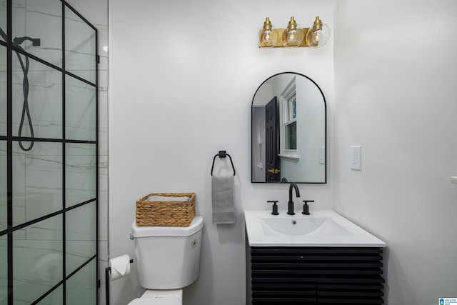 bathroom with vanity, toilet, and walk in shower