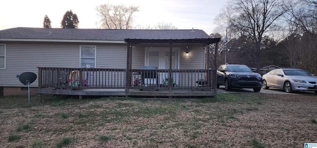 view of front of home featuring a wooden deck