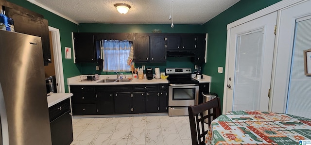 kitchen with a textured ceiling, stainless steel appliances, and sink