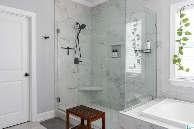 bathroom with crown molding and shower with separate bathtub