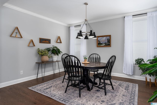 dining space featuring a chandelier, dark hardwood / wood-style flooring, and crown molding