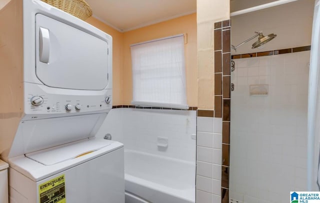 clothes washing area featuring crown molding and stacked washer and clothes dryer