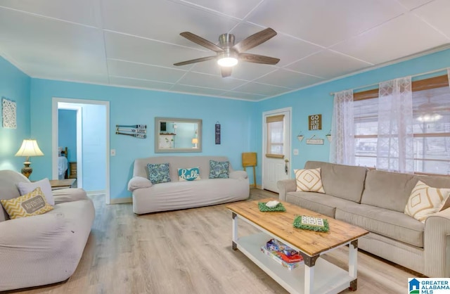 living room with ceiling fan and light hardwood / wood-style flooring