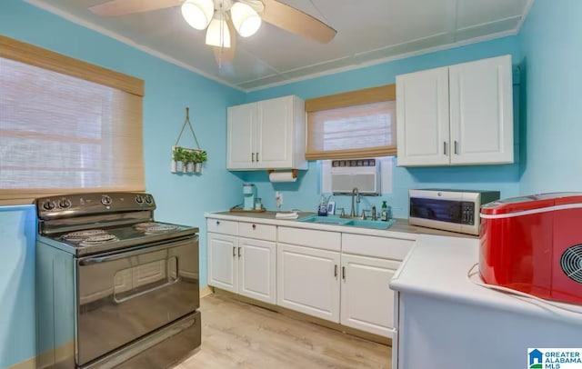 kitchen with white cabinets, ceiling fan, black electric range oven, and sink