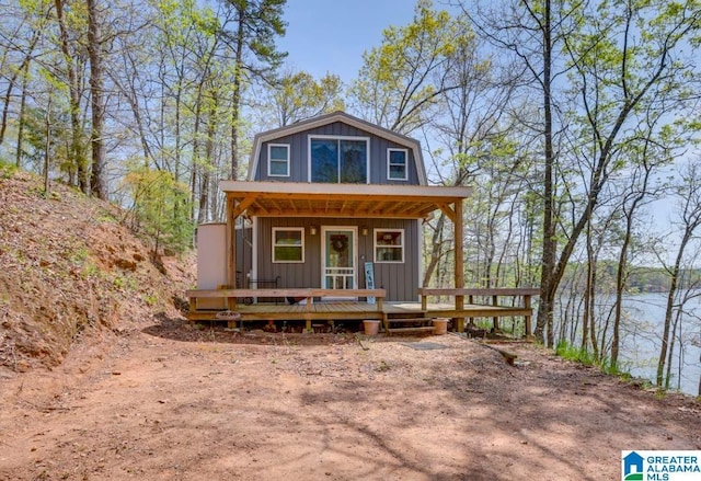 view of front of house with a water view