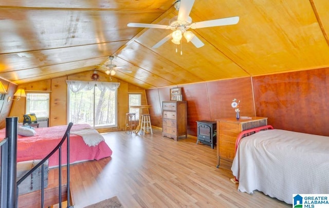 bedroom with ceiling fan, light hardwood / wood-style floors, wooden ceiling, and vaulted ceiling