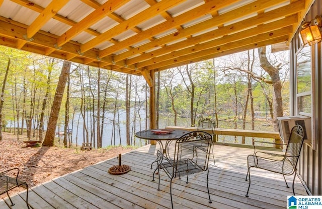 exterior space featuring cooling unit and a water view