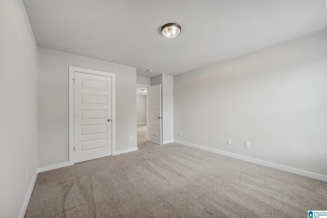 unfurnished bedroom featuring a closet and carpet floors