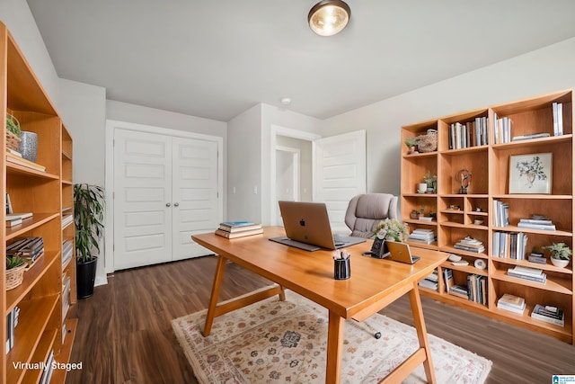 office space with dark wood-type flooring