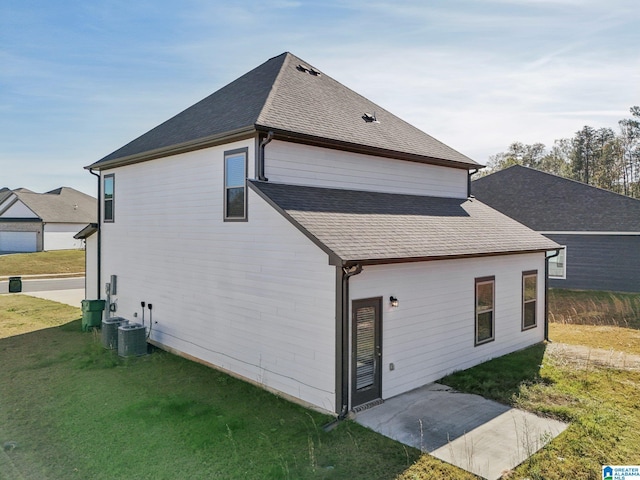 back of house featuring a yard and a patio