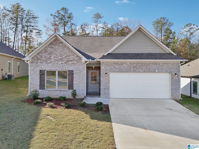 view of front of house featuring cooling unit, a garage, and a front lawn