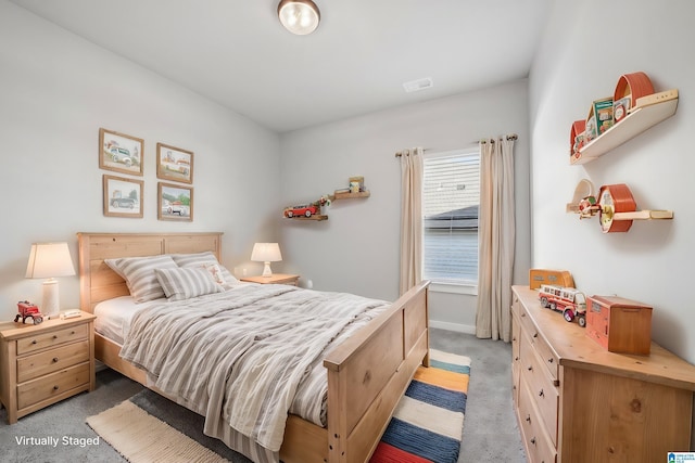 bedroom featuring light carpet