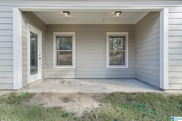 entrance to property with a patio