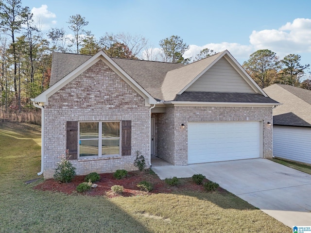 view of front of property featuring a front yard and a garage