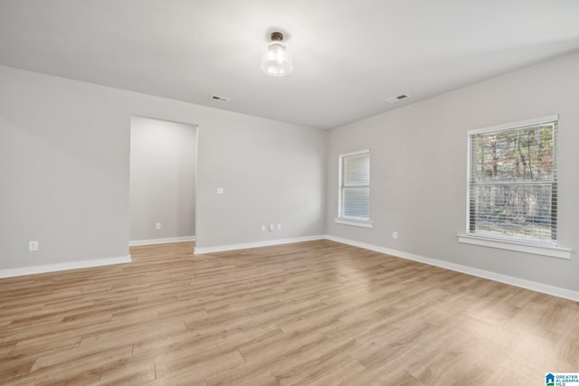 spare room featuring light hardwood / wood-style floors