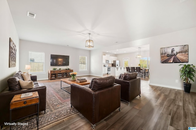 living room with dark wood-type flooring