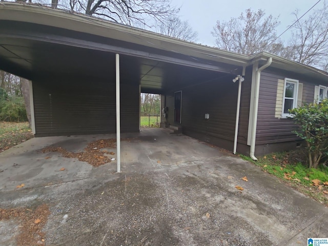 view of vehicle parking featuring a carport