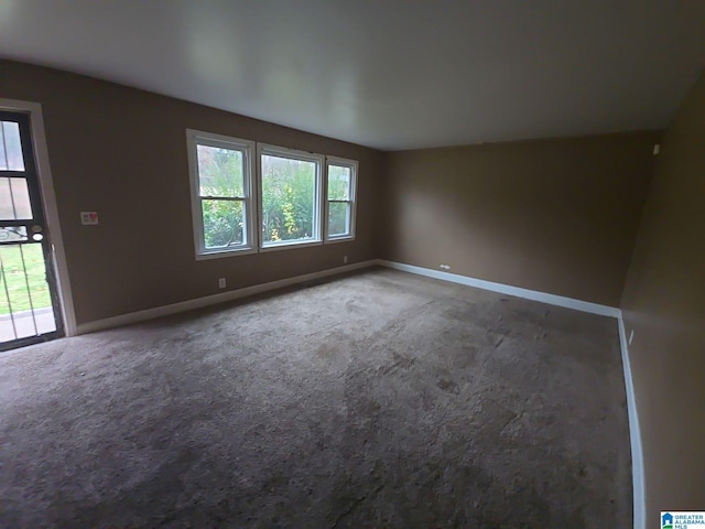 unfurnished room with carpet floors