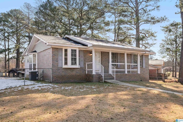 single story home with a front lawn and central AC unit