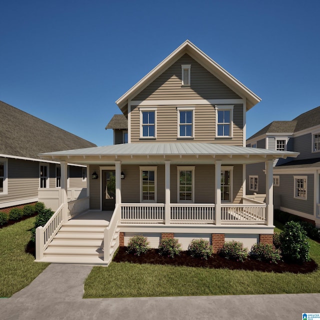 view of front facade featuring a front yard and covered porch