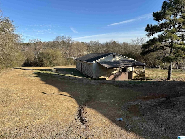 view of outdoor structure with a lawn