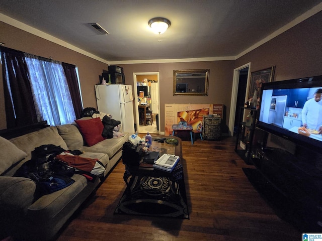 living room featuring ornamental molding and dark hardwood / wood-style floors