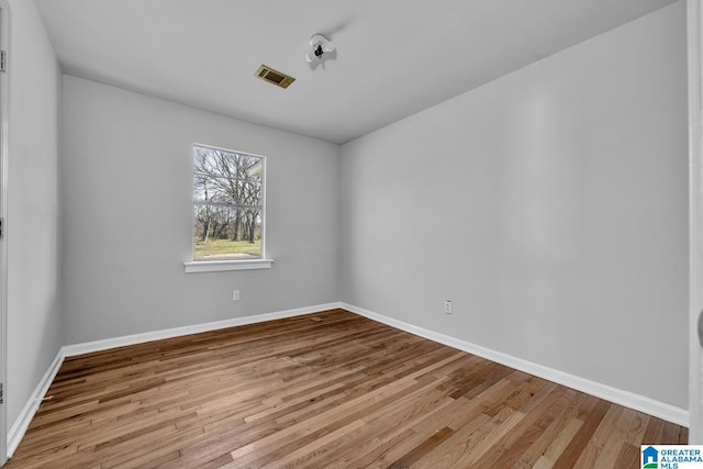 spare room with light hardwood / wood-style flooring